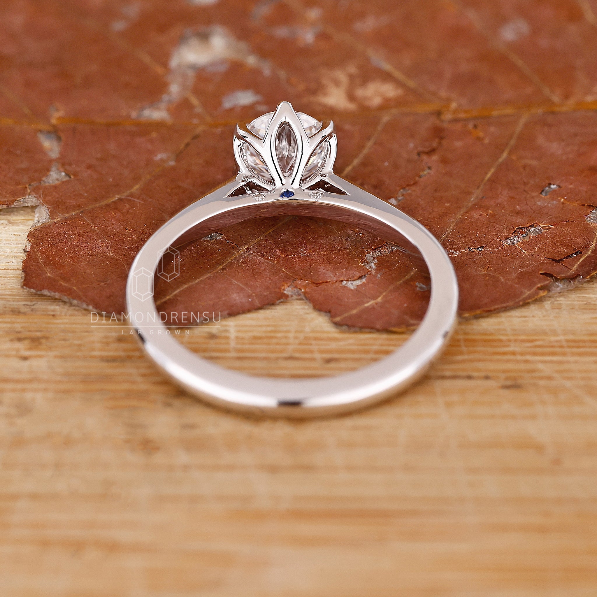 Tulip setting ring with lab grown round diamond and prong mount.
