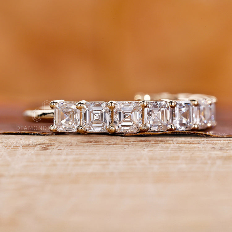 Yellow gold band with Asscher diamonds.