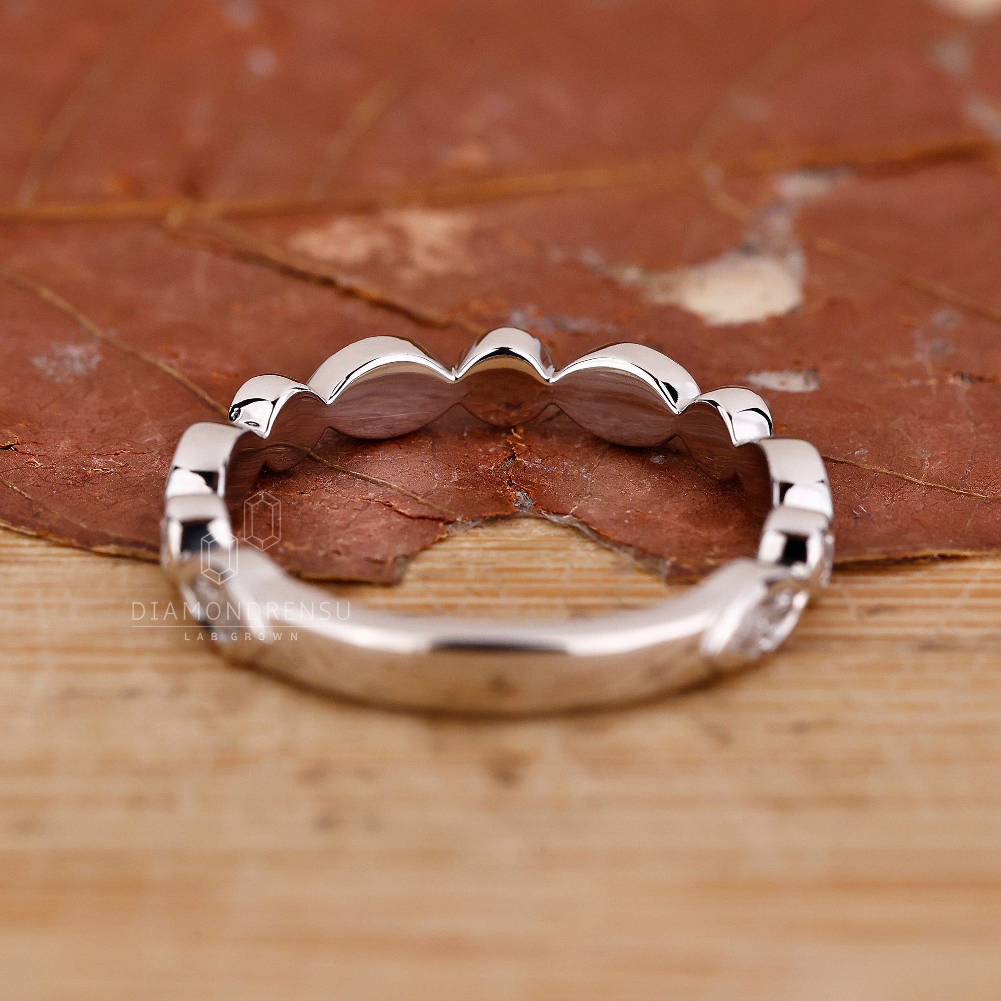 Lab Grown Diamond wedding band in a bezel set white gold design.