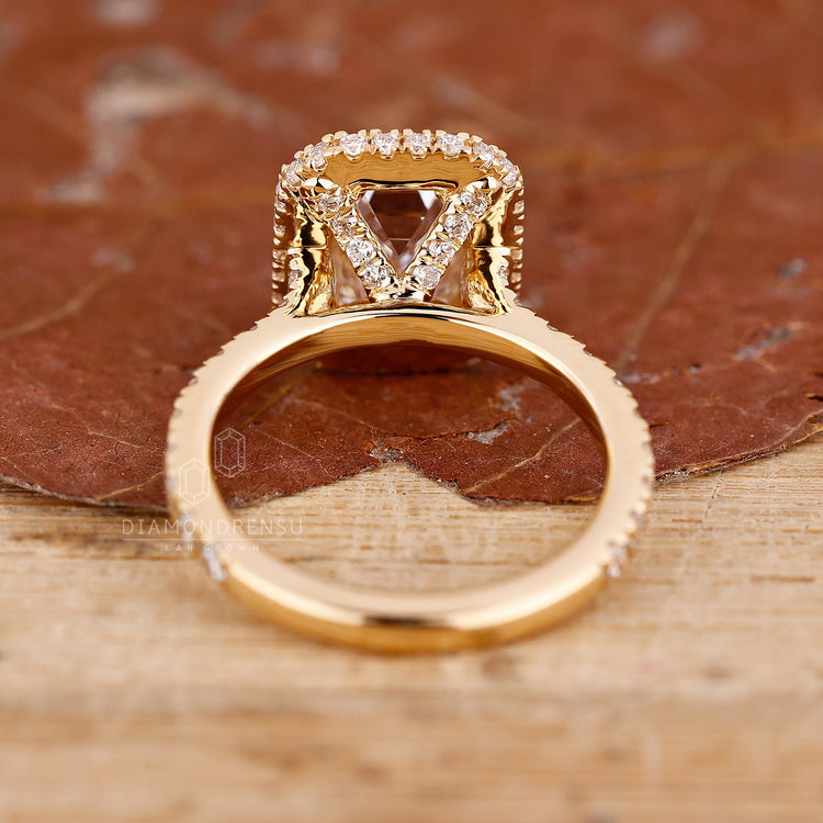 Diamond ring UK collection includes emerald halo and pave ring.