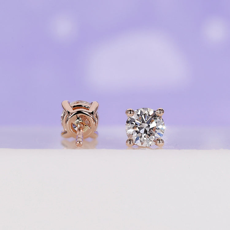 Elegant rose gold handmade earrings set with lab grown round diamonds.