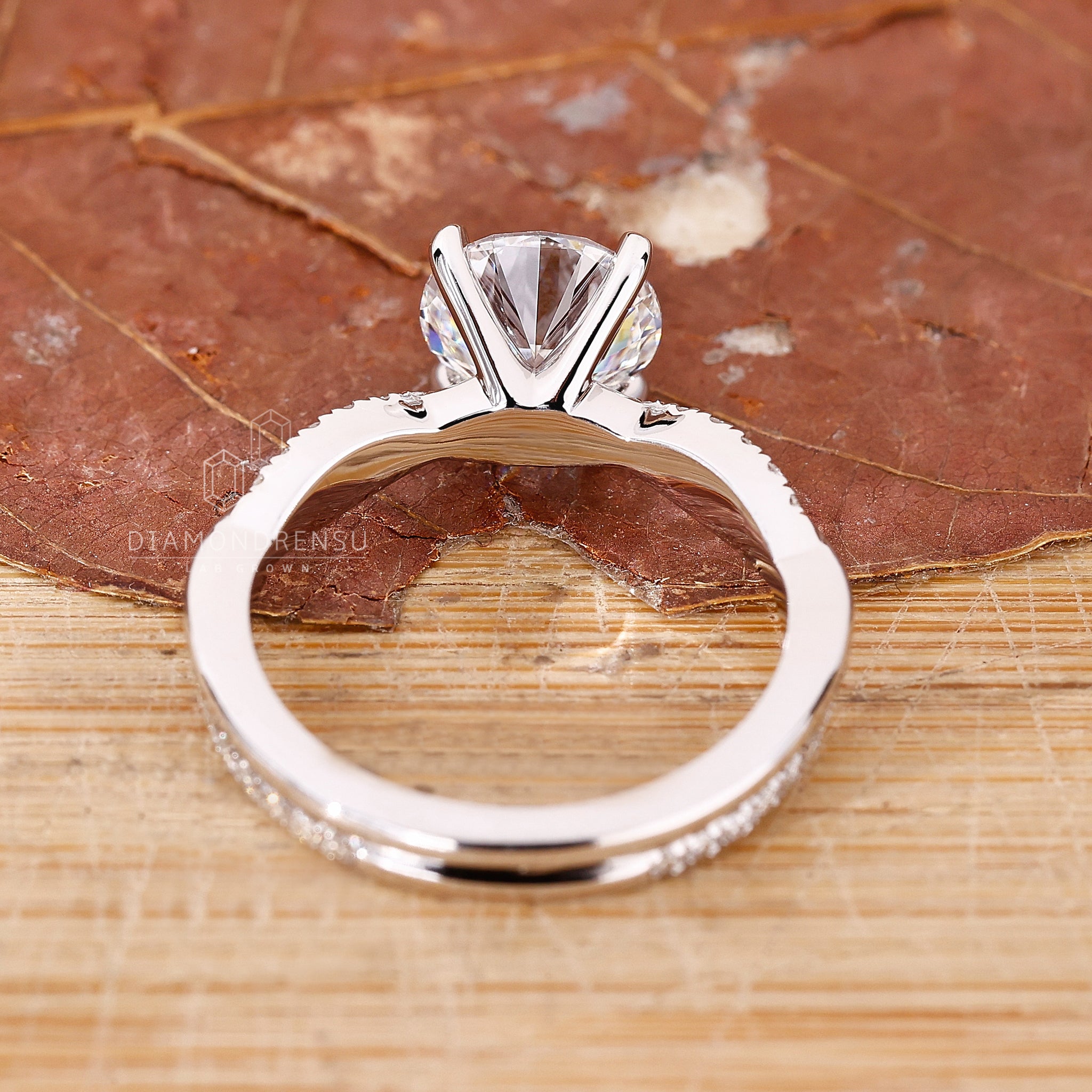 Lab grown diamond ring with custom twisted band and prong setting.