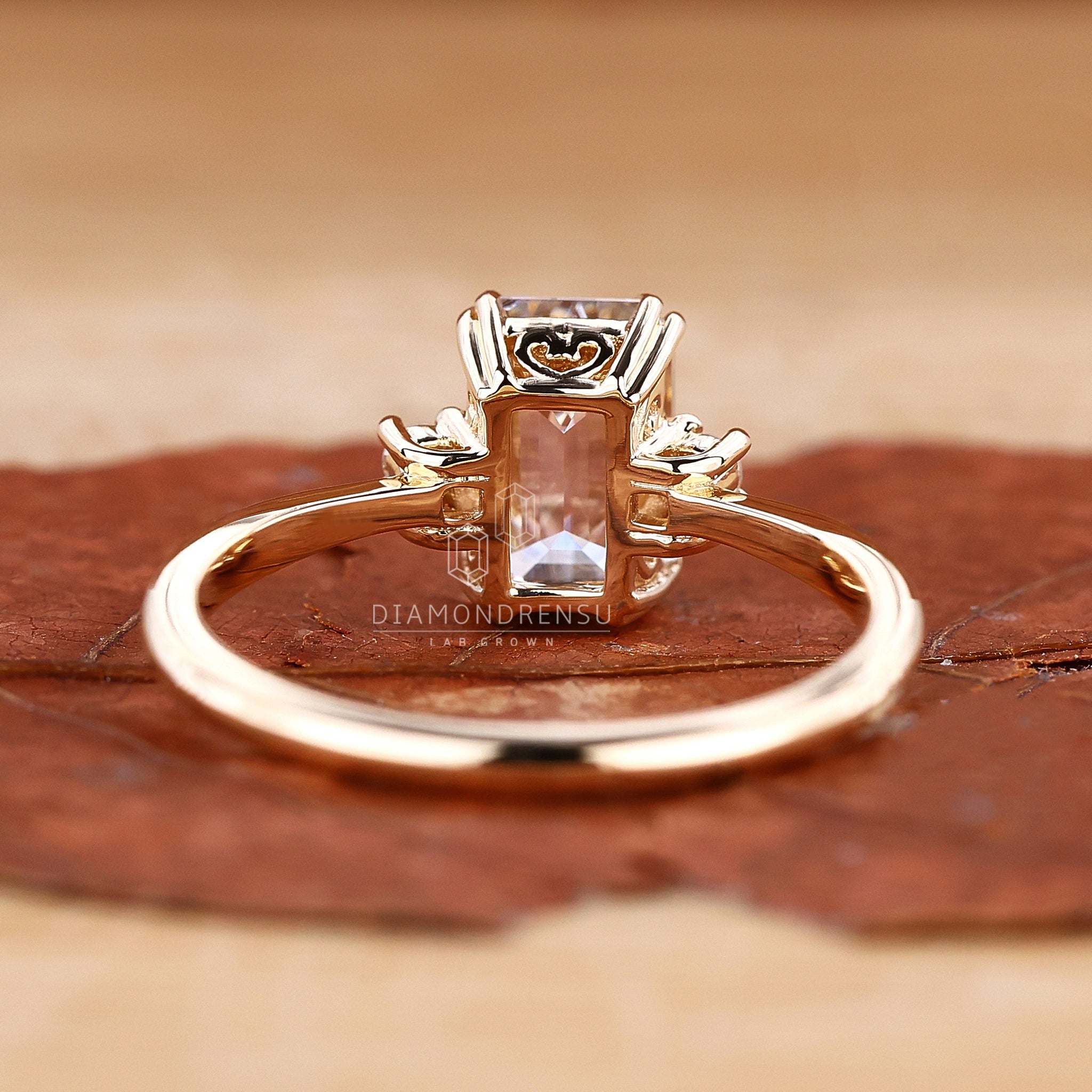 Emerald cut ring with flawless diamonds in a timeless setting.