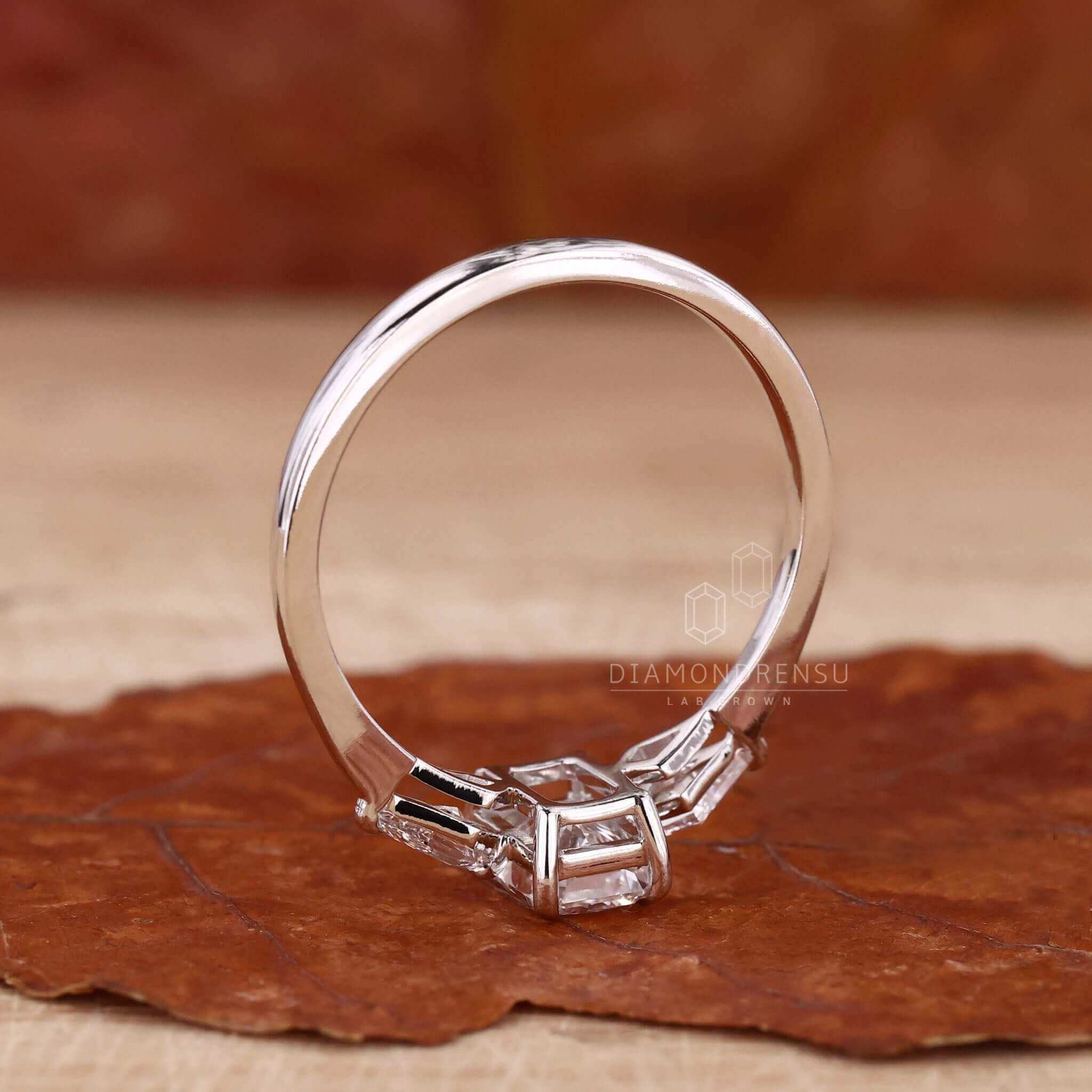 Kite cut diamond engagement ring paired with a radiant cut diamond for a unique style.