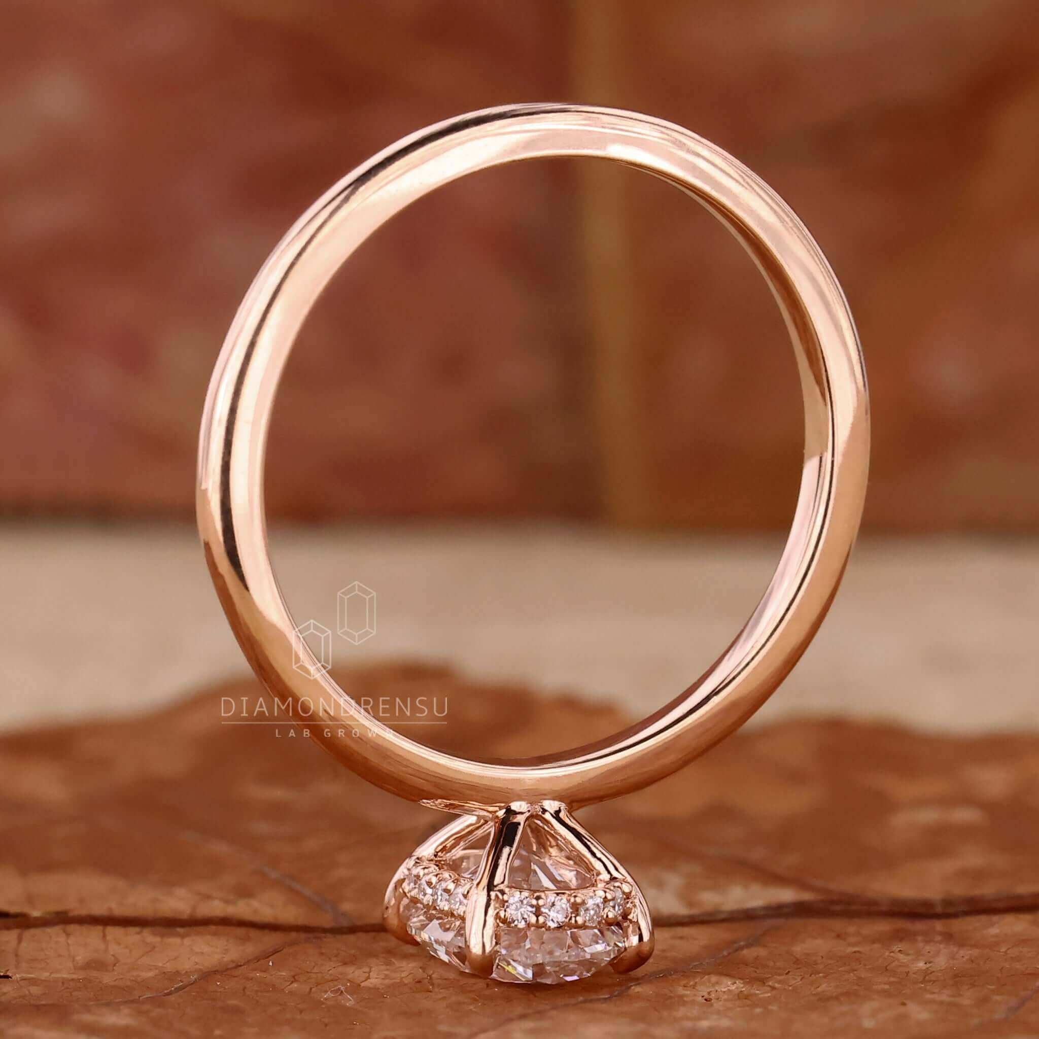 Lab grown diamond set in yellow gold ring.