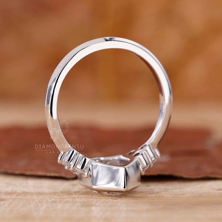 Custom engagement ring with bezel setting and lab grown diamond.
