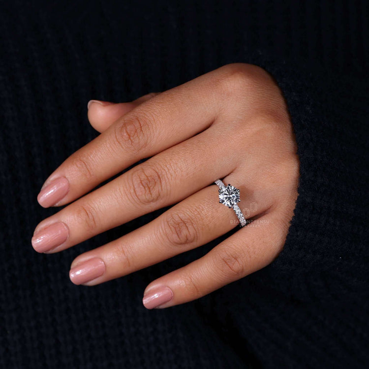 Classic engagement ring featuring a round diamond in a pave setting, ideal for modern yet timeless elegance.