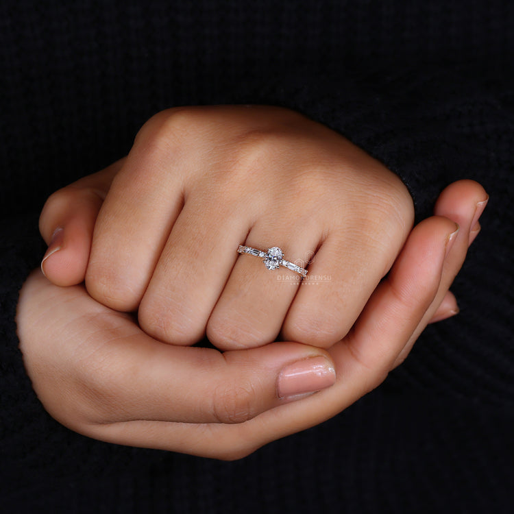 Round cut side diamond in 4 prong setting.