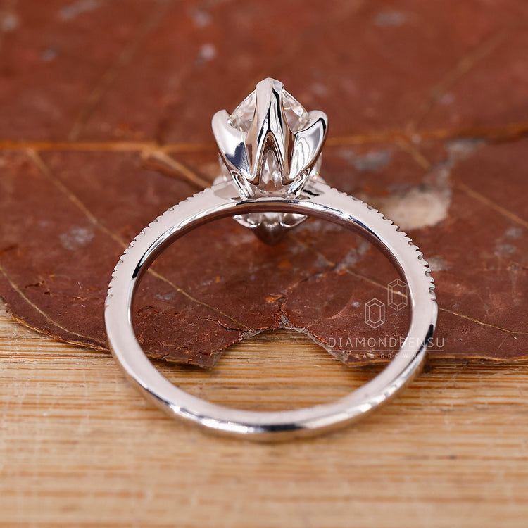 Handmade jewellery ring featuring round cut pave and prong settings.