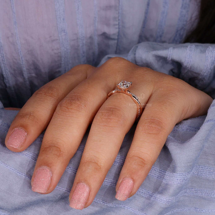 Princess cut diamond ring featuring a rose gold ring and 4 prong claw setting for timeless beauty.