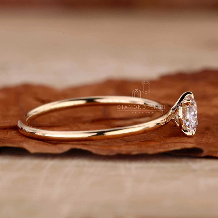 2 carat oval diamond ring with a 4 prong claw setting, ideal for UK engagement traditions.