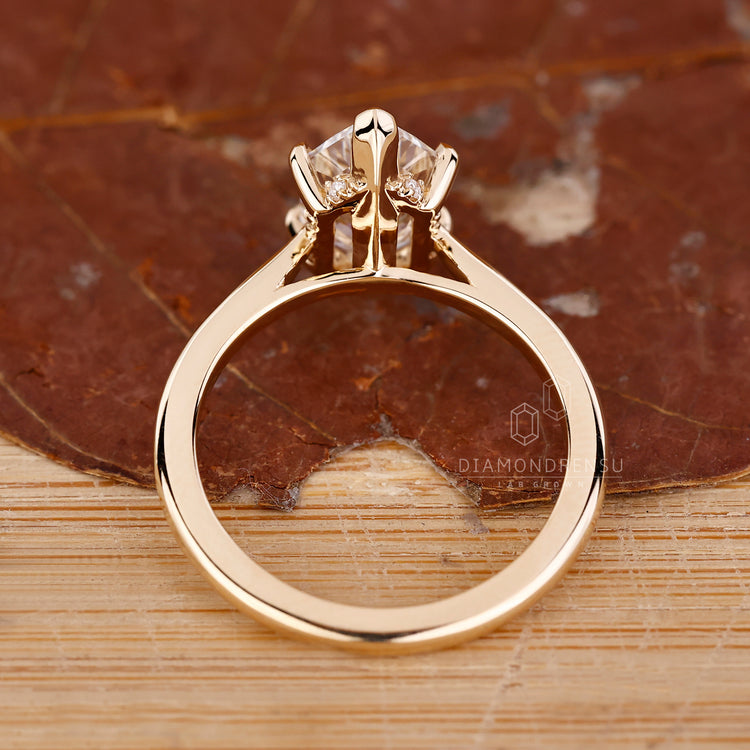 Yellow gold ring with a polished shine.