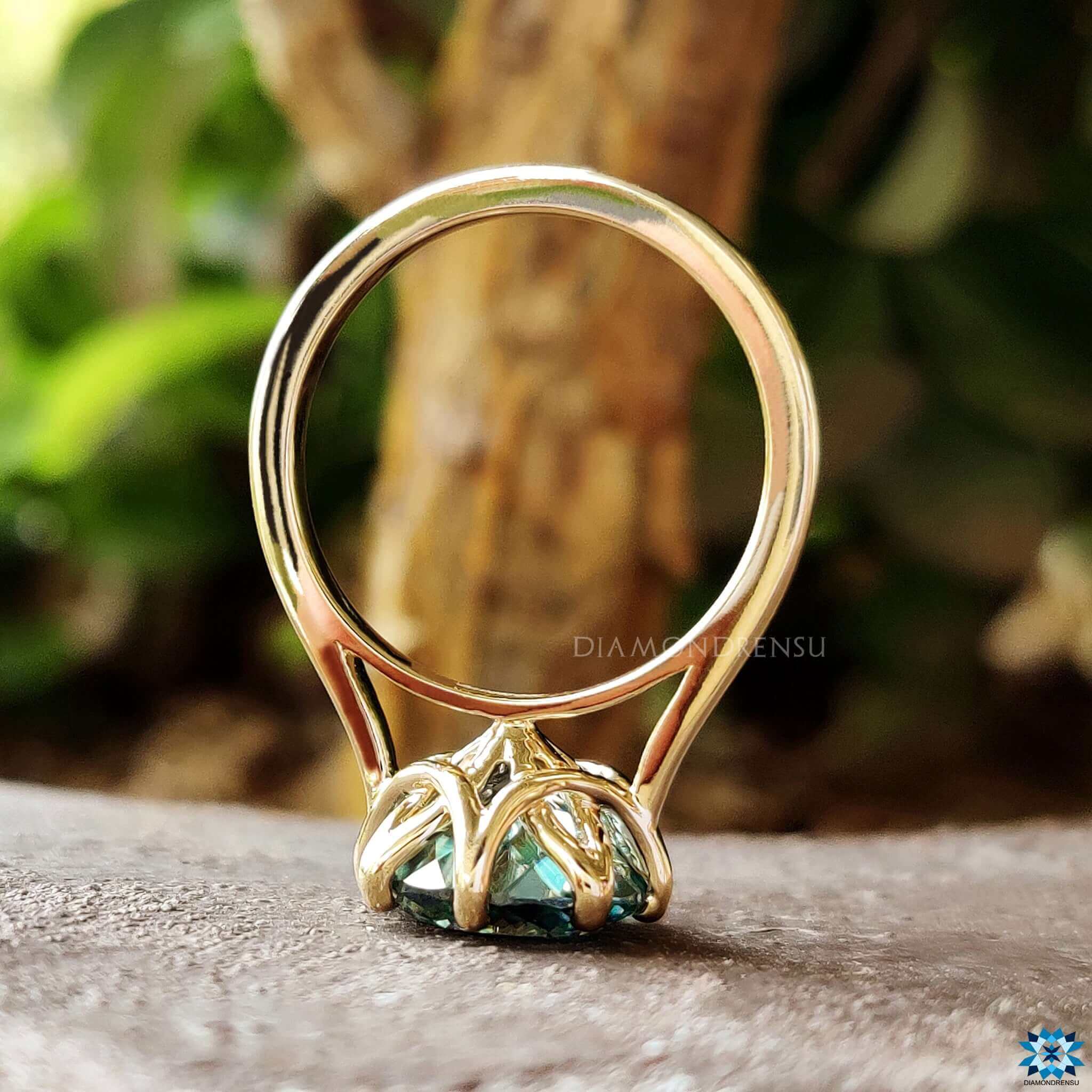 Solitaire style engagement ring in yellow gold.