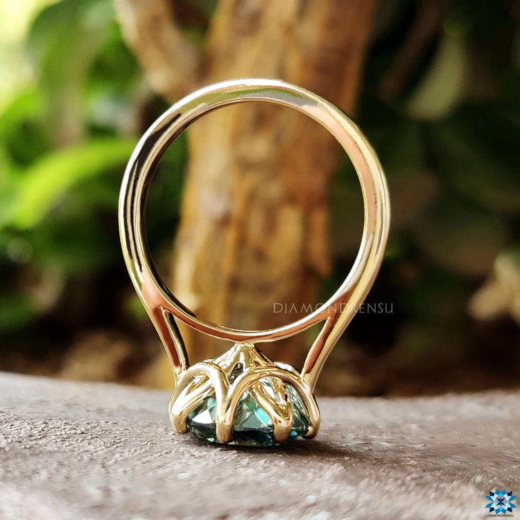 Solitaire style engagement ring in yellow gold.