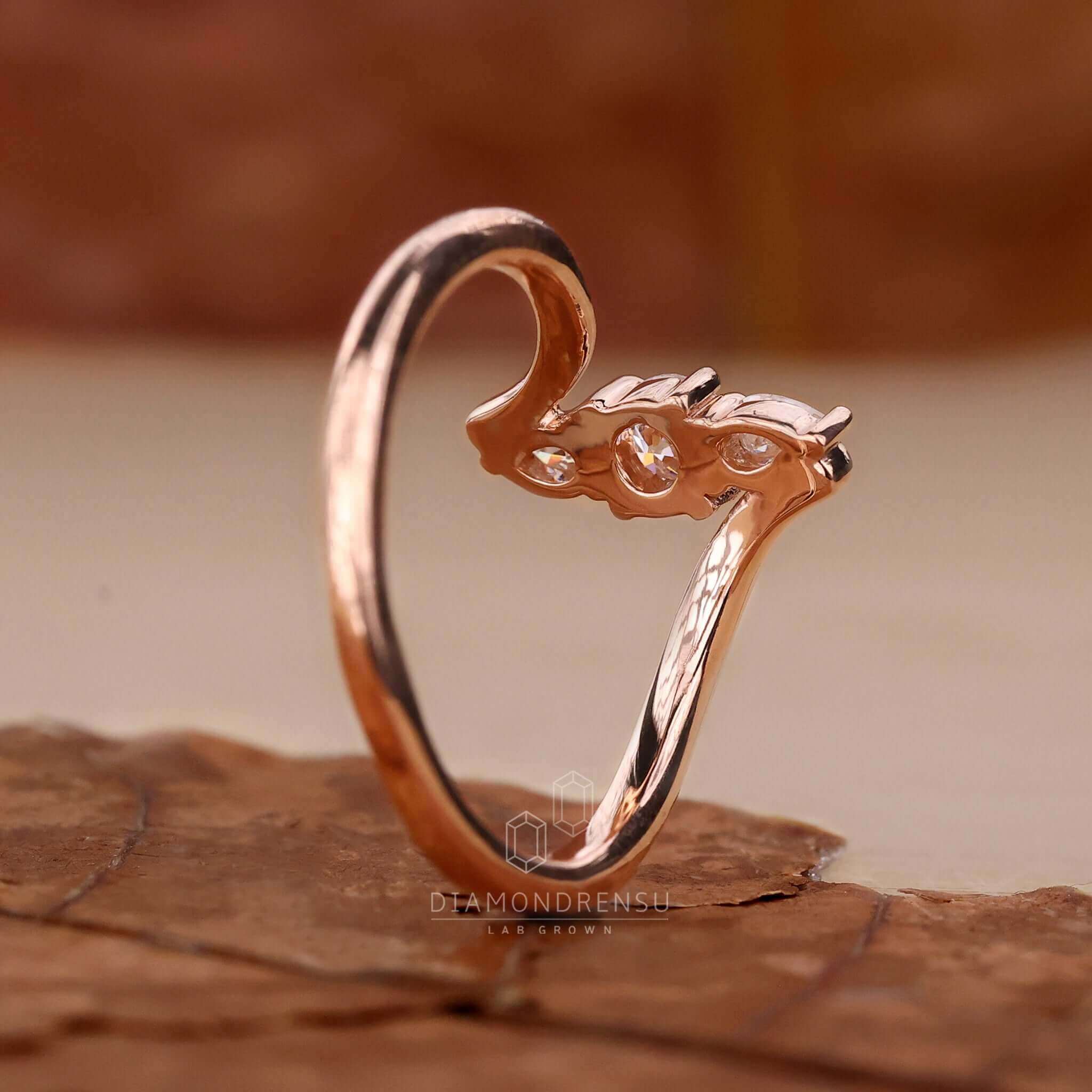 Pear diamond ring with a stunning bypass ring design for a modern and elegant style.