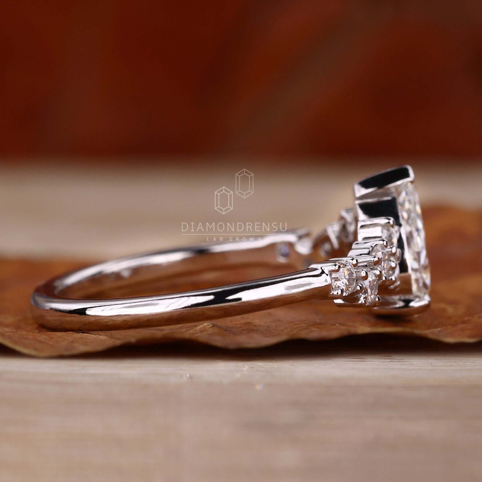 Lab grown pear diamond ring with handmade jewelry detailing, offering a sustainable option for elegant engagements.
