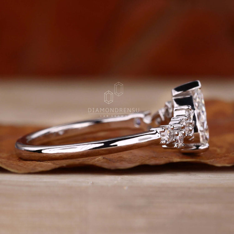 Lab grown pear diamond ring with handmade jewelry detailing, offering a sustainable option for elegant engagements.