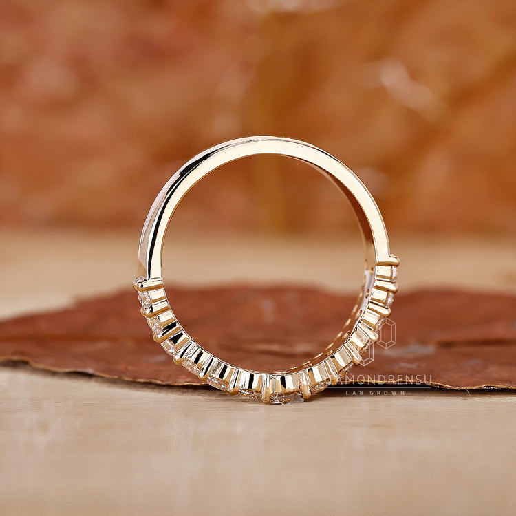Curved wedding band with lab grown diamonds.
