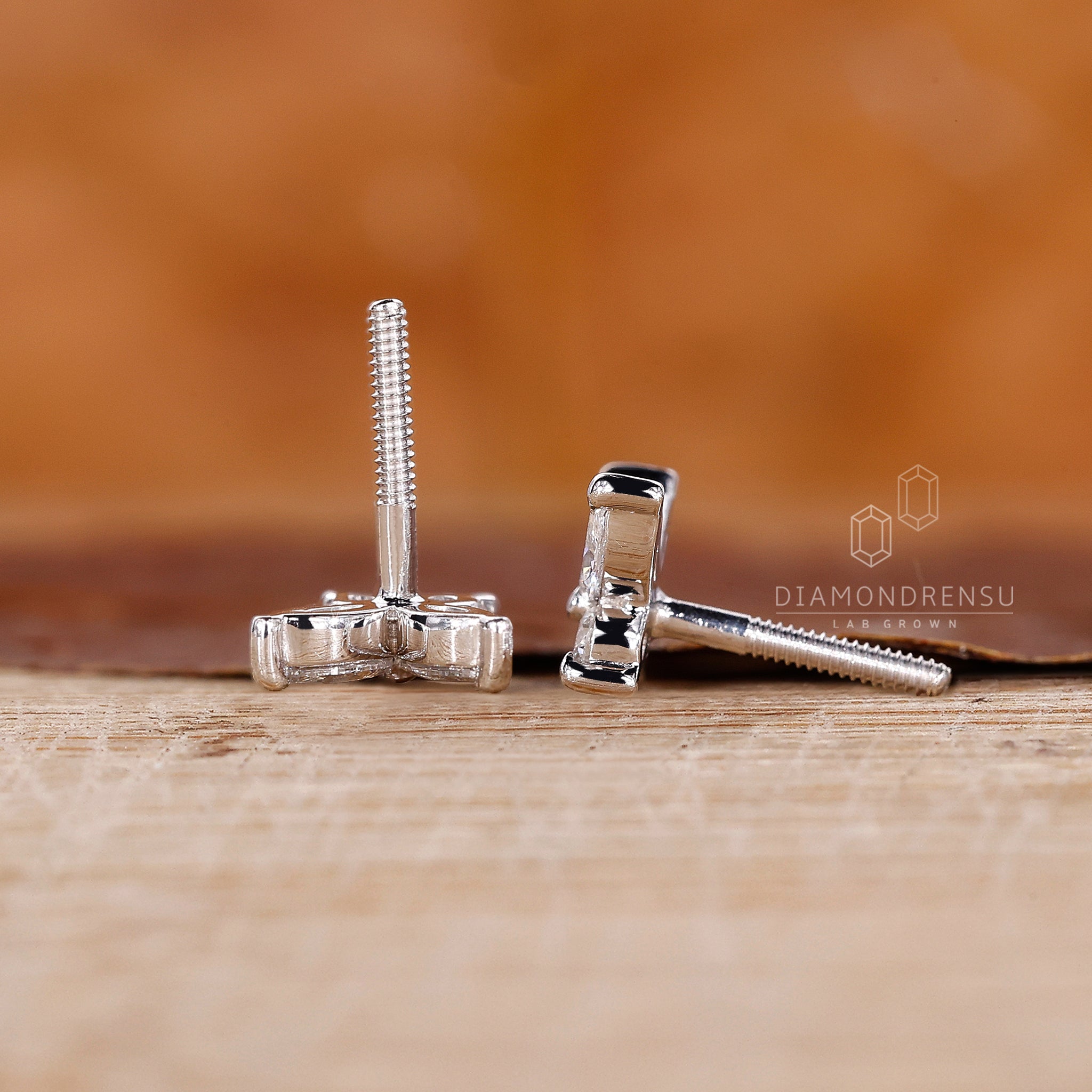 Round prong set diamond earrings.