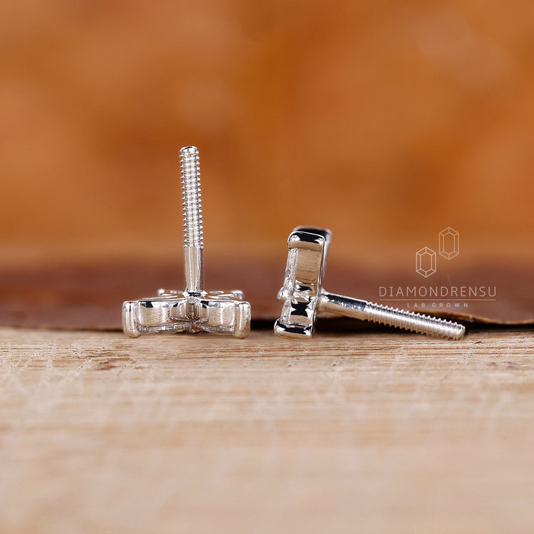 Round prong set diamond earrings.