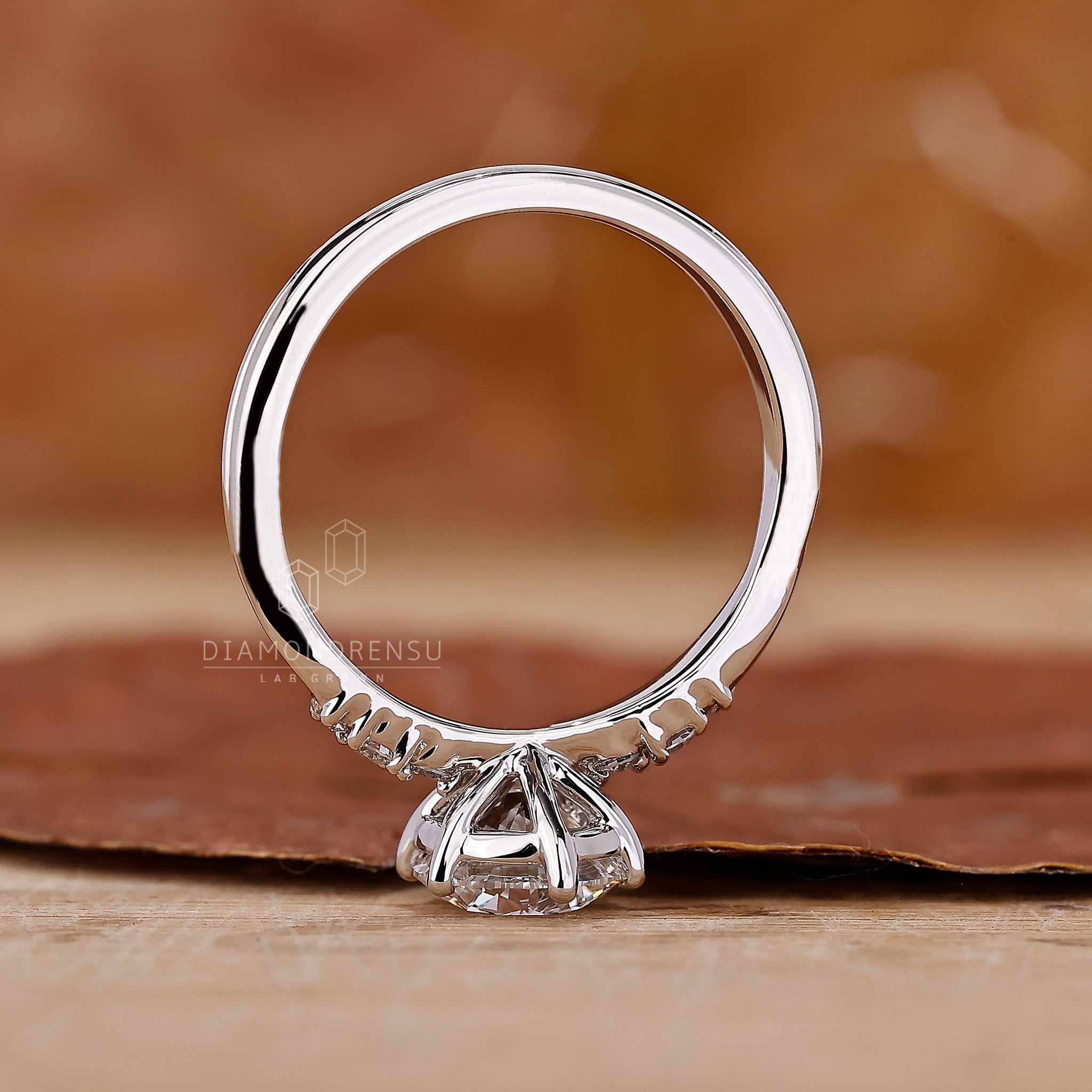 Diamondrensu UK engagement ring with six prong ring setting.