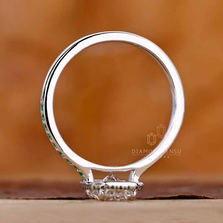 Prong setting halo ring in classic white gold finish.
