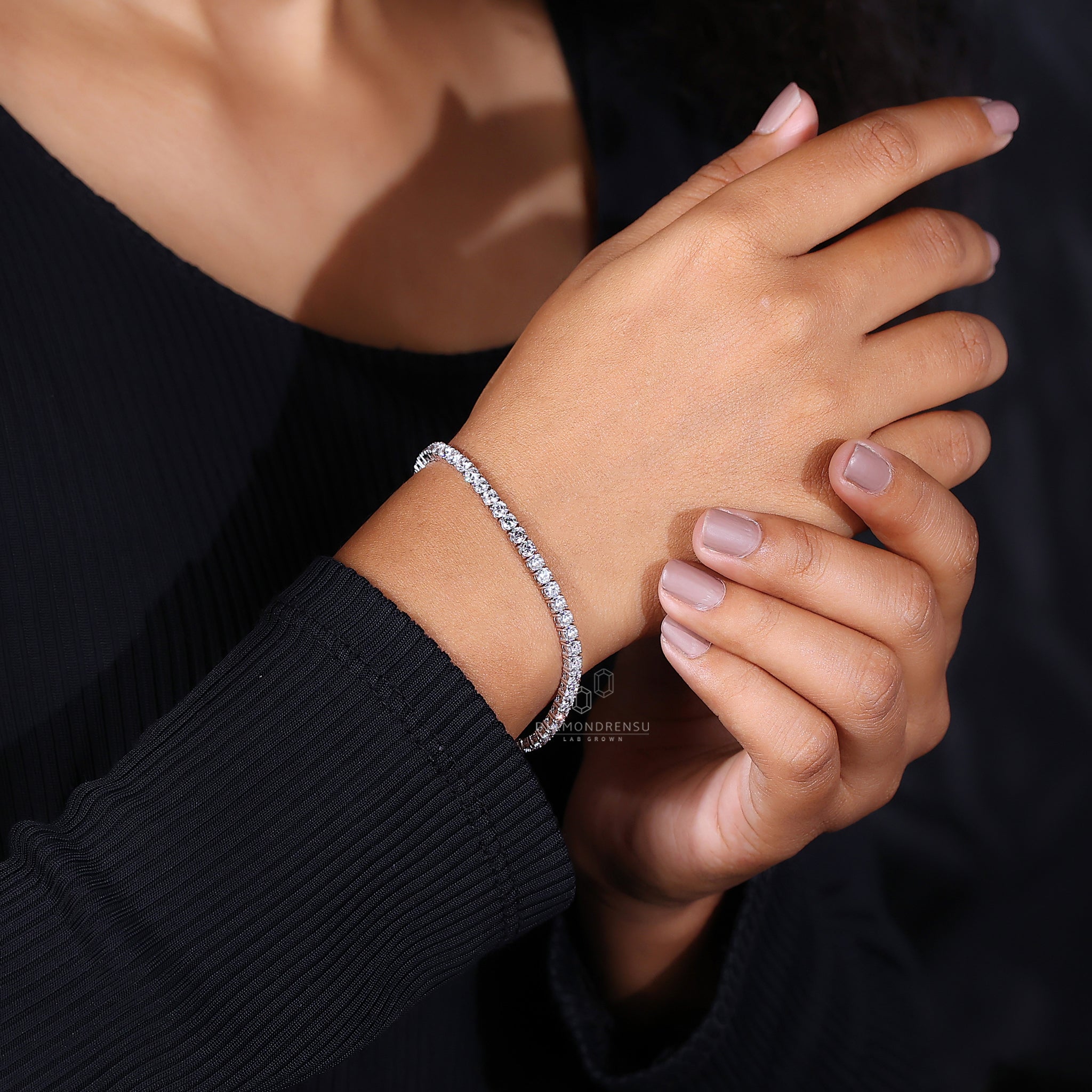 Handmade bracelet designed in white gold with round cut diamonds.