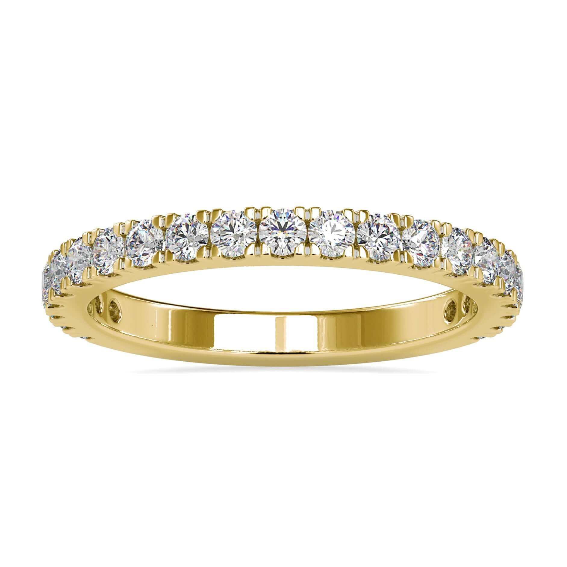 Gold diamond wedding band featuring 3/4 round cut diamonds.