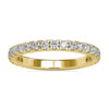 Gold diamond wedding band featuring 3/4 round cut diamonds.