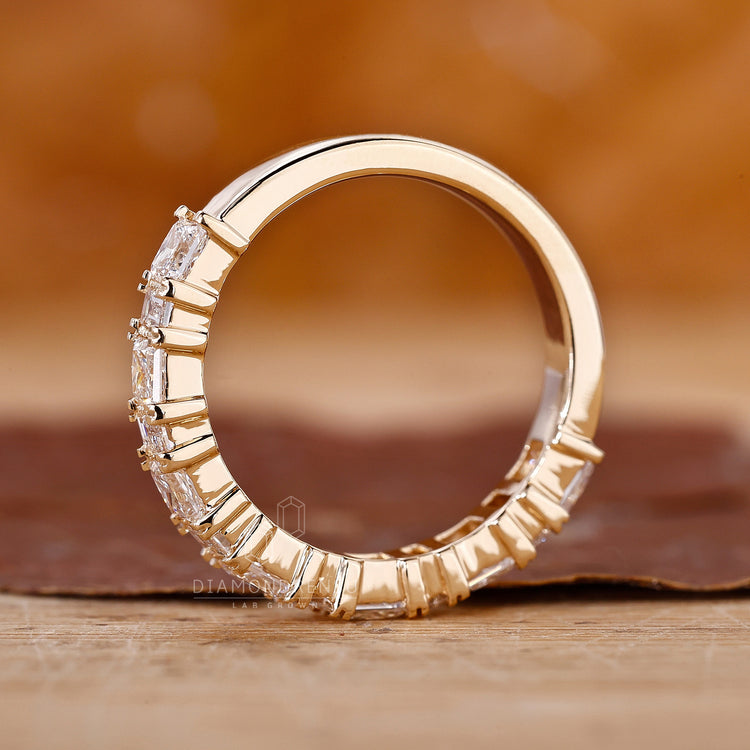 Handmade jewellery in yellow gold with prong set diamond accents.