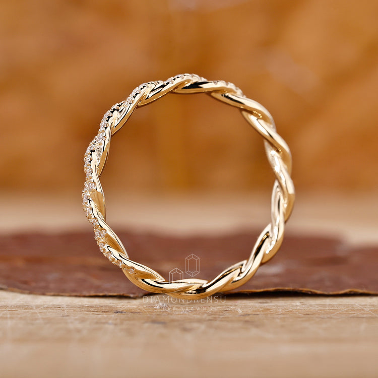 Minimalist twisted diamond wedding ring.