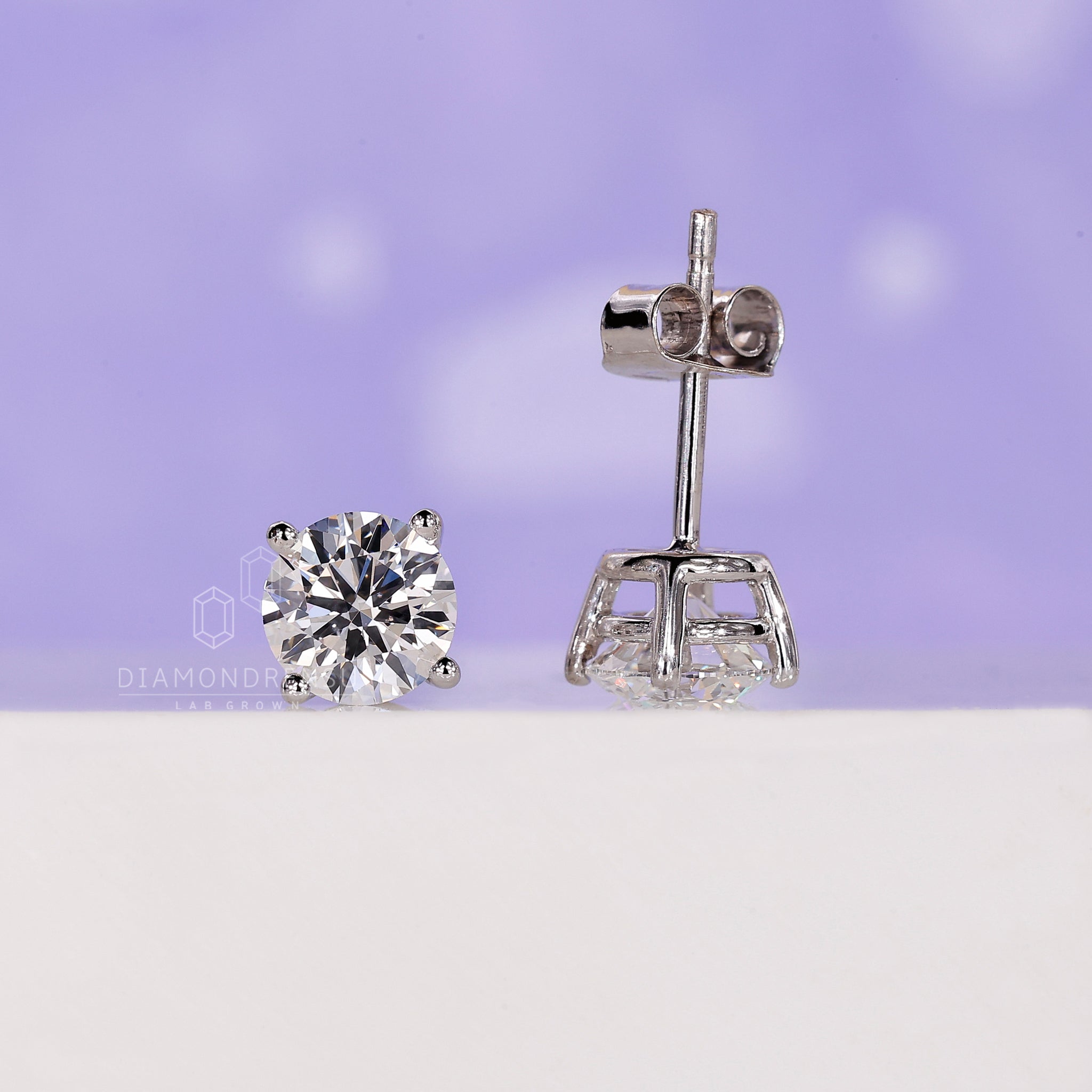 White gold round cut diamond earrings.