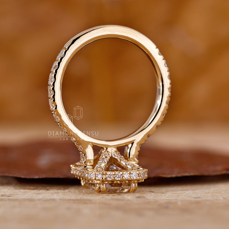 Handmade jewelry is used to complete this emerald engagement ring.