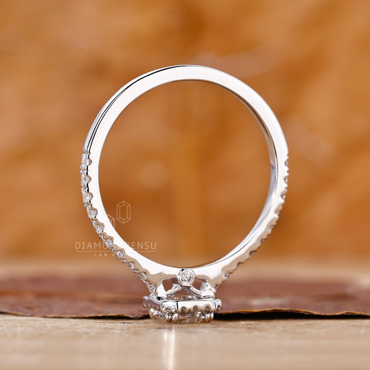 Unique engagement ring features emerald cut style.