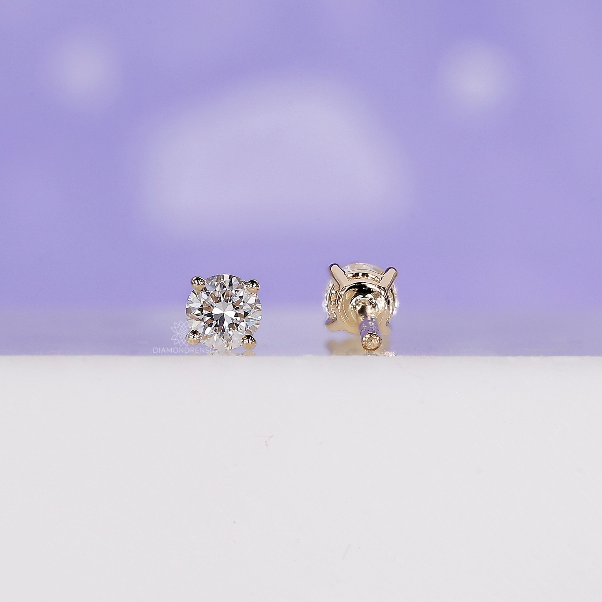 Classic yellow gold diamond studs.