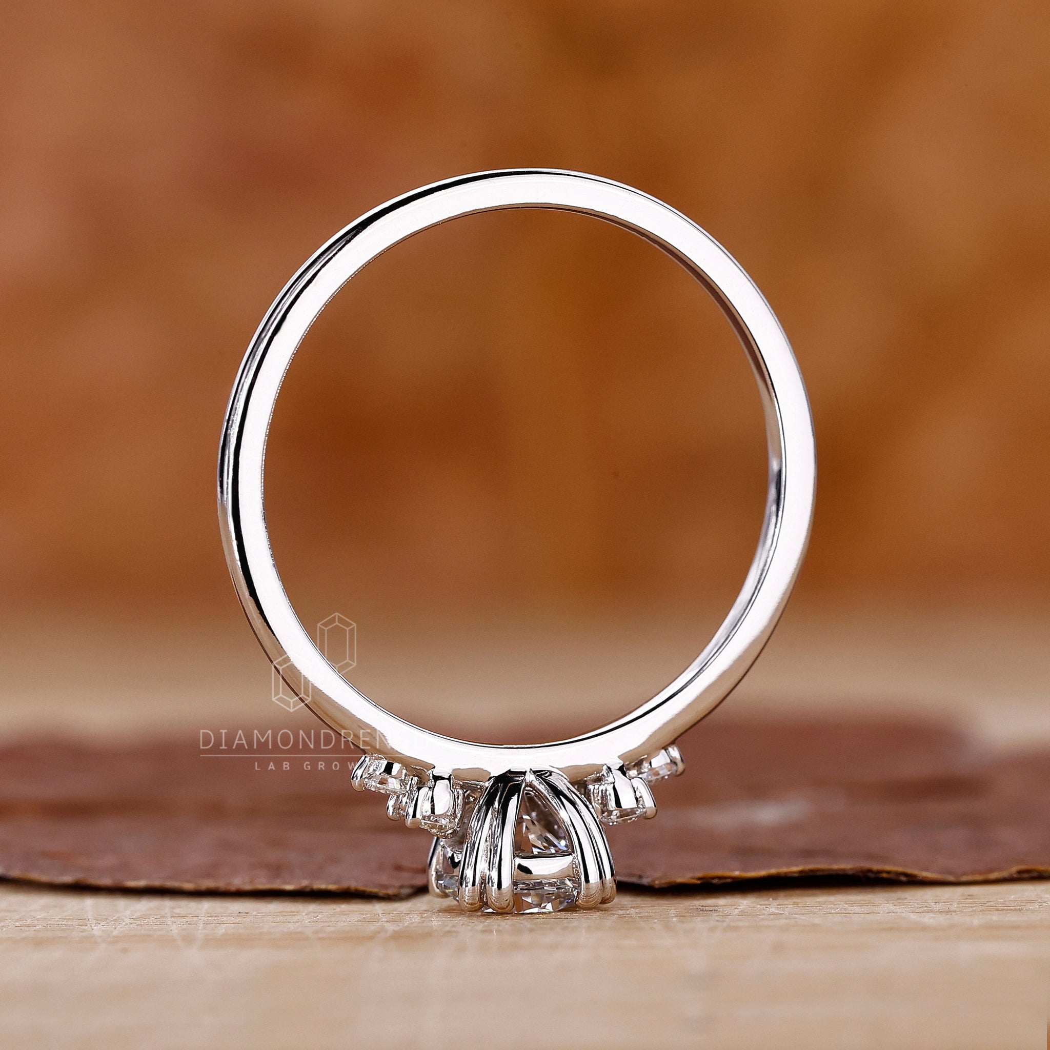 Lab diamond ring with double prong setting and round diamonds in UK style.
