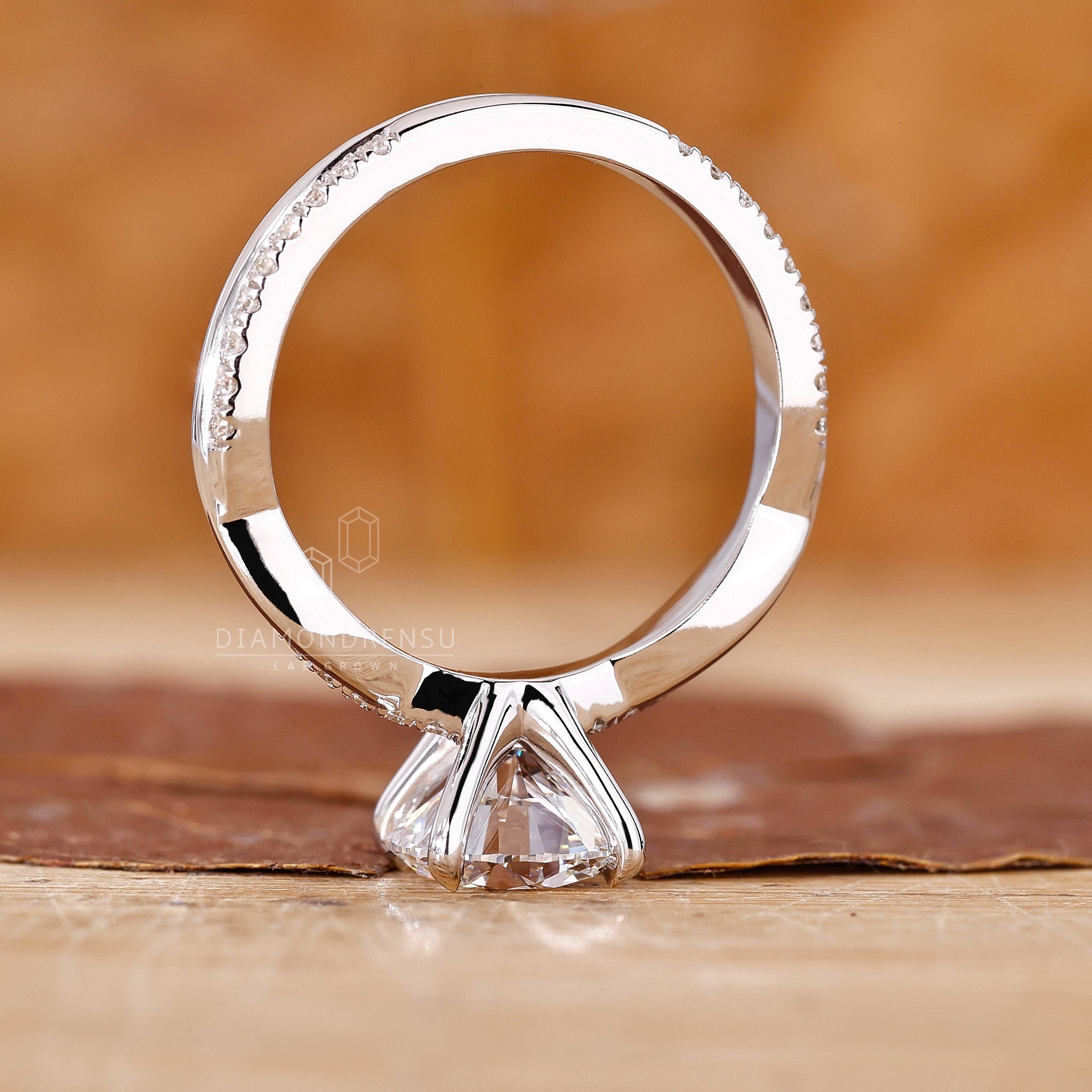 Handmade jewellery ring featuring twisted pave and white gold design.