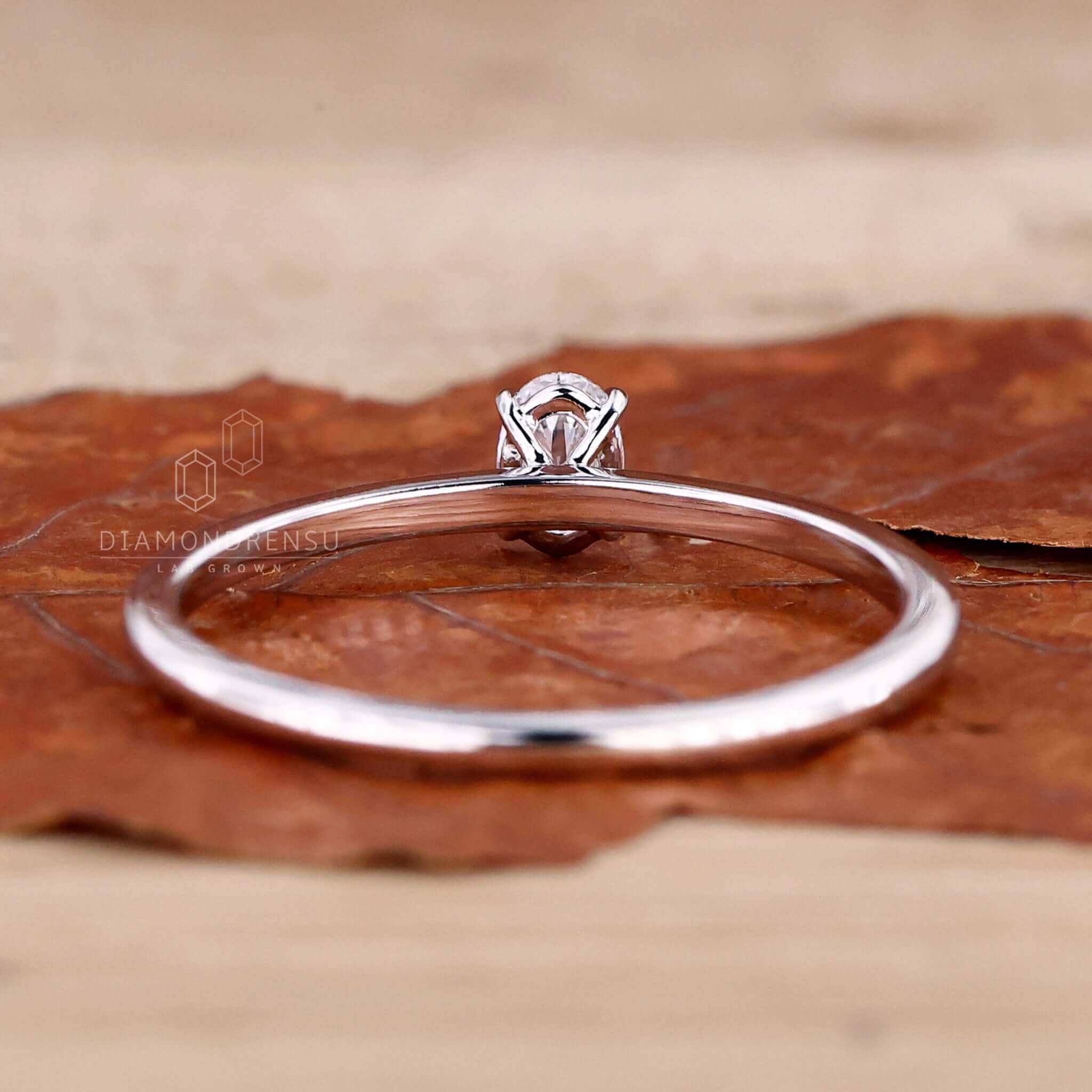 4 prong diamond setting in a white gold engagement ring, designed for a modern and unique engagement ring style.