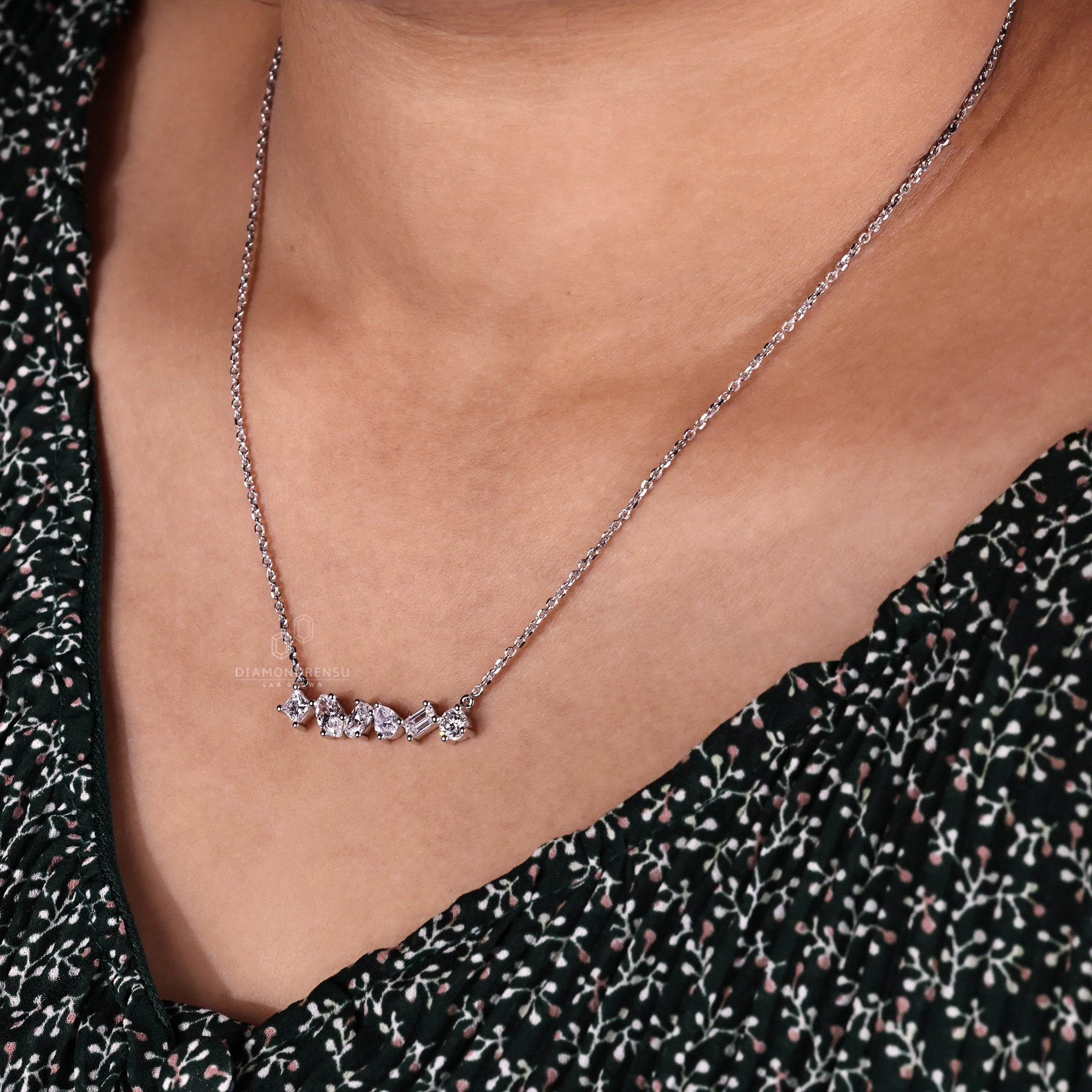 Oval cut diamond pendant set in white gold with a secure prong setting.