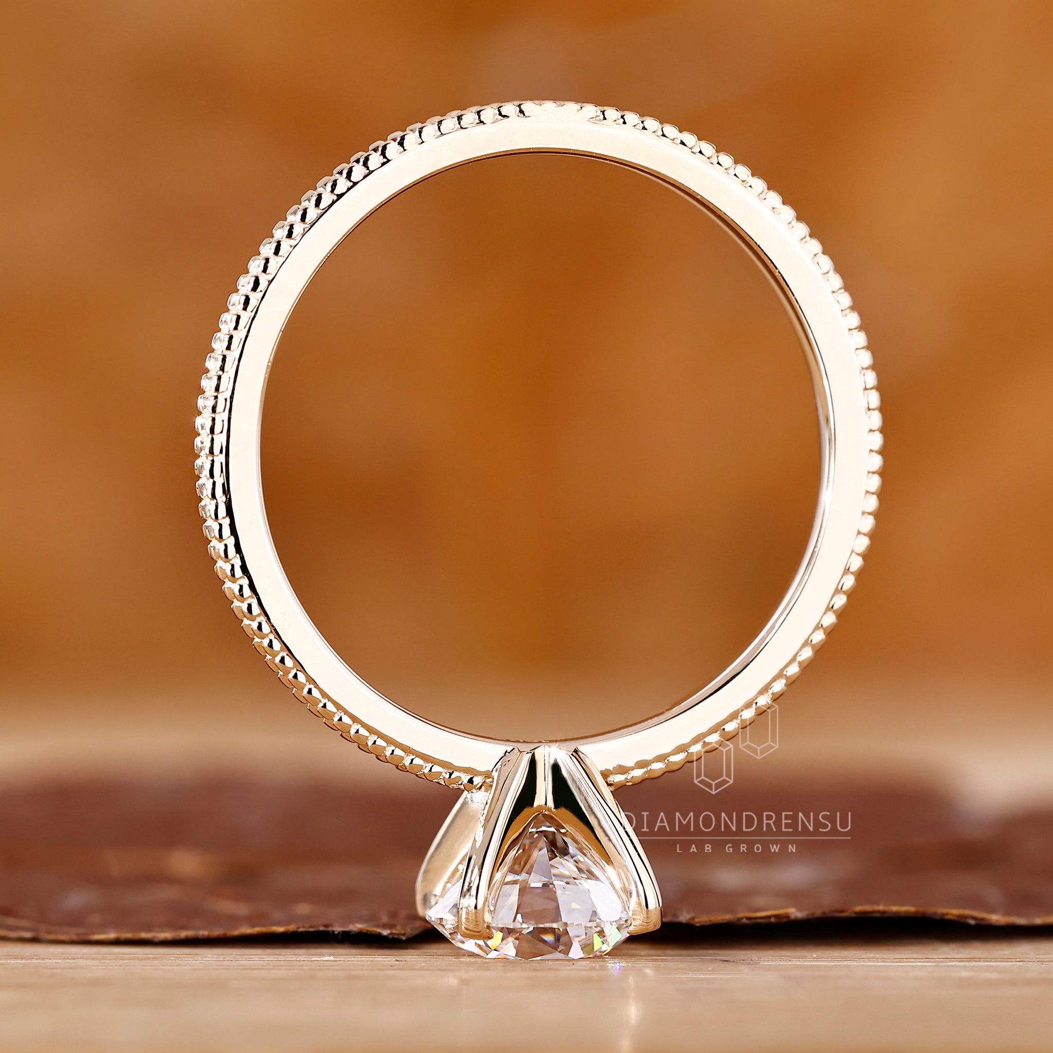 Four prong setting ring with round lab diamond