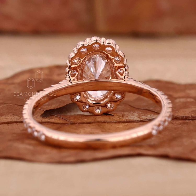 Exquisite oval diamond ring with halo accents.