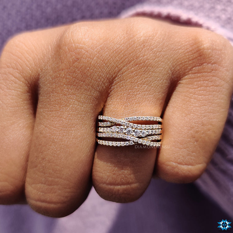 Yellow gold engagement ring with criss cross multi row band.