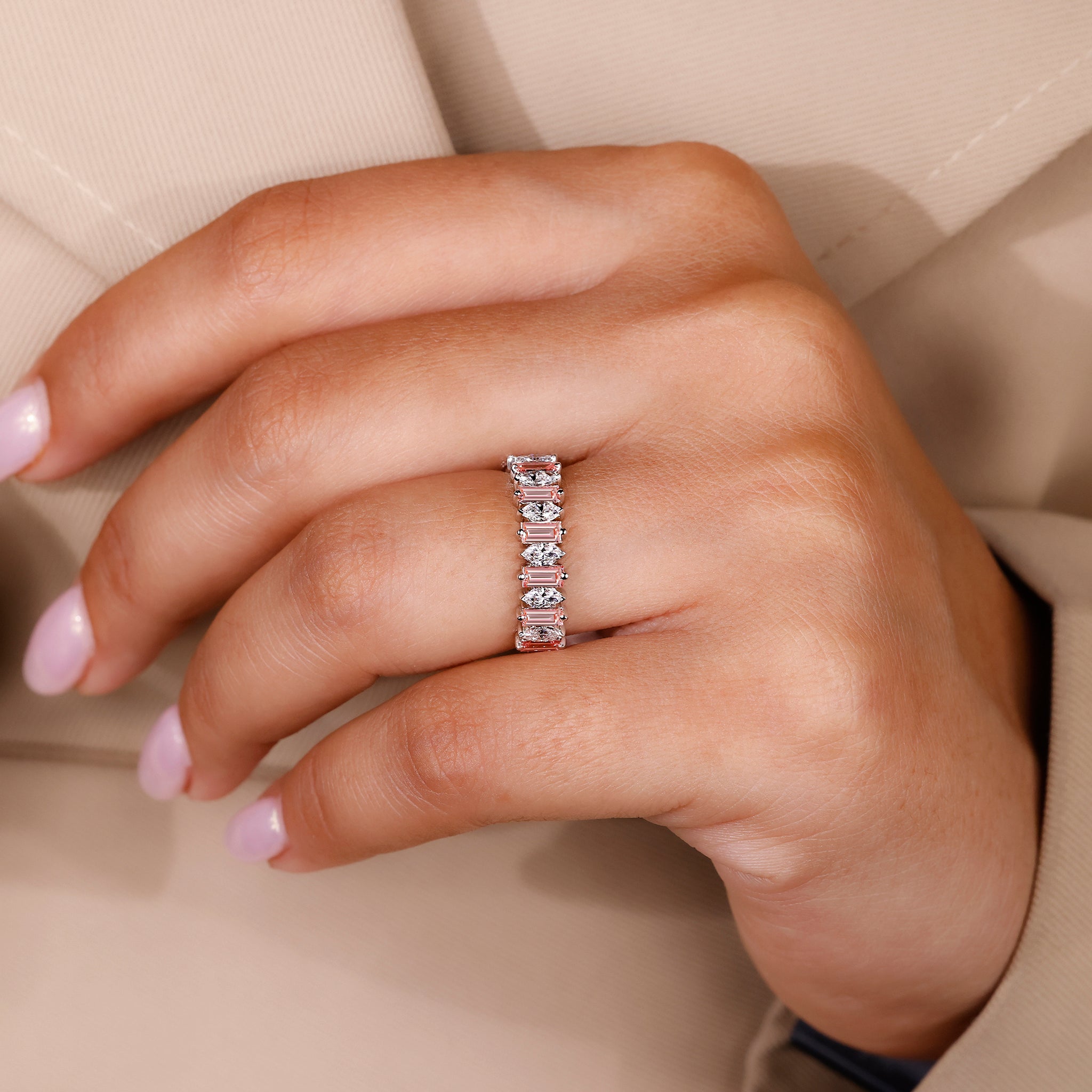 Prong set wedding band combining white gold and pink baguette diamonds.