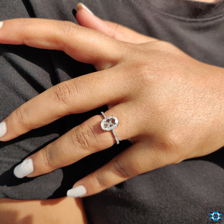 Round cut pave band with 4 claw prong setting on oval rose cut ring.