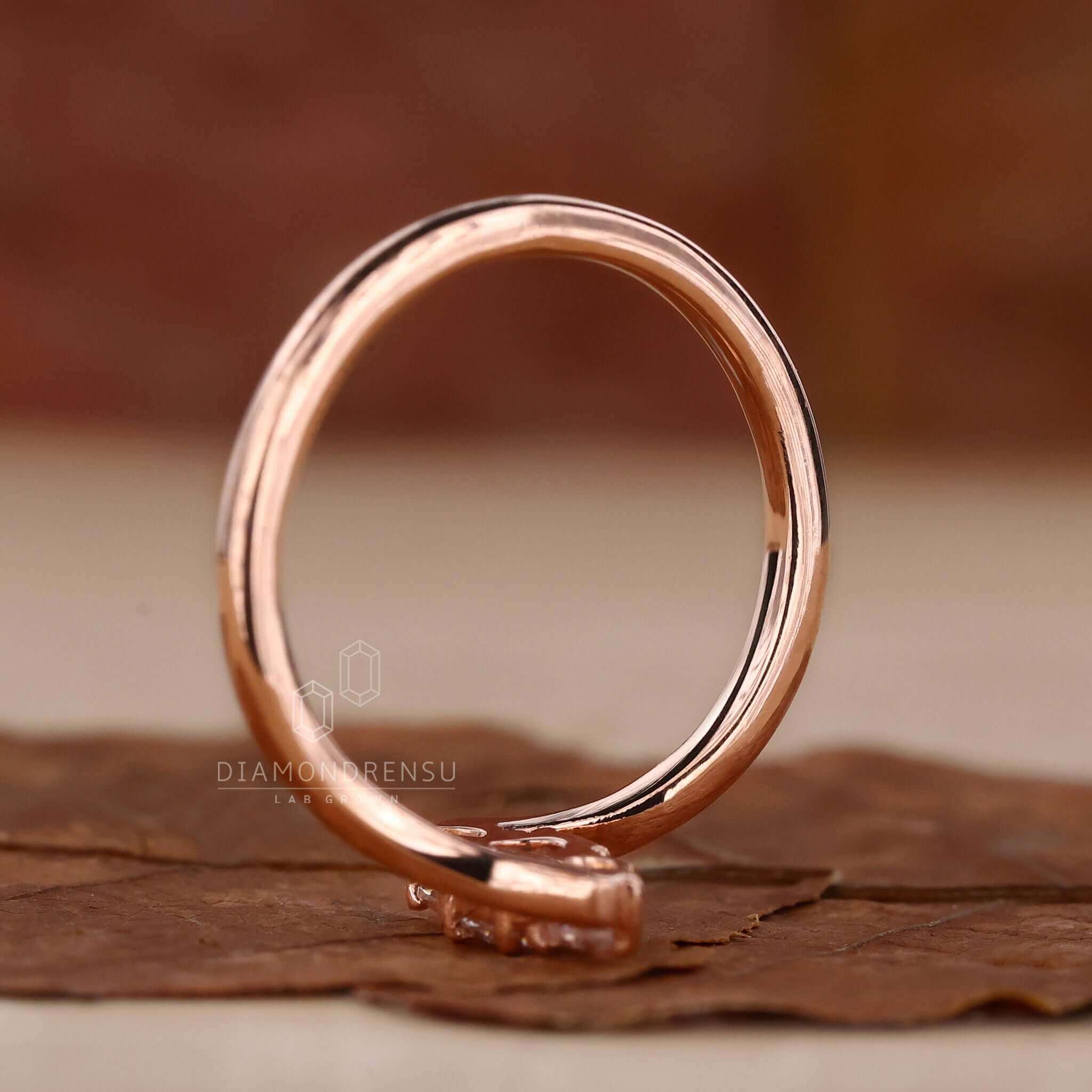 Pear diamond engagement ring set in rose gold for a timeless and romantic design.