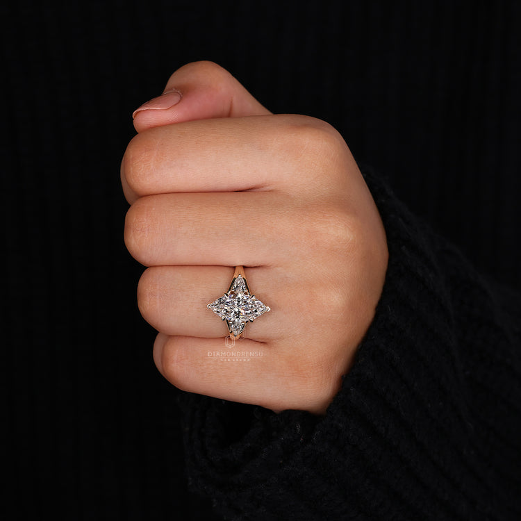 UK engagement ring featuring pear side stones.