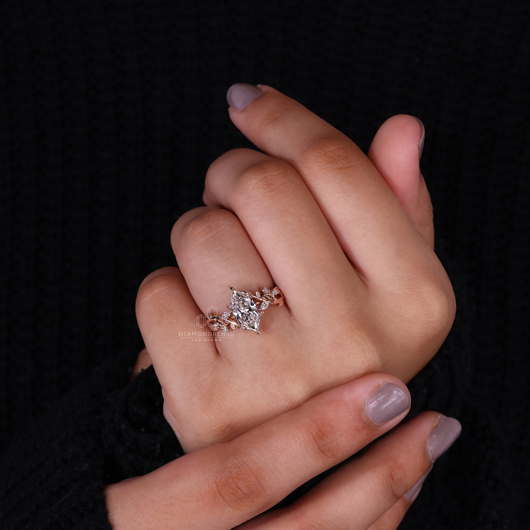 Handmade Ring featuring a marquise and round side stone design.