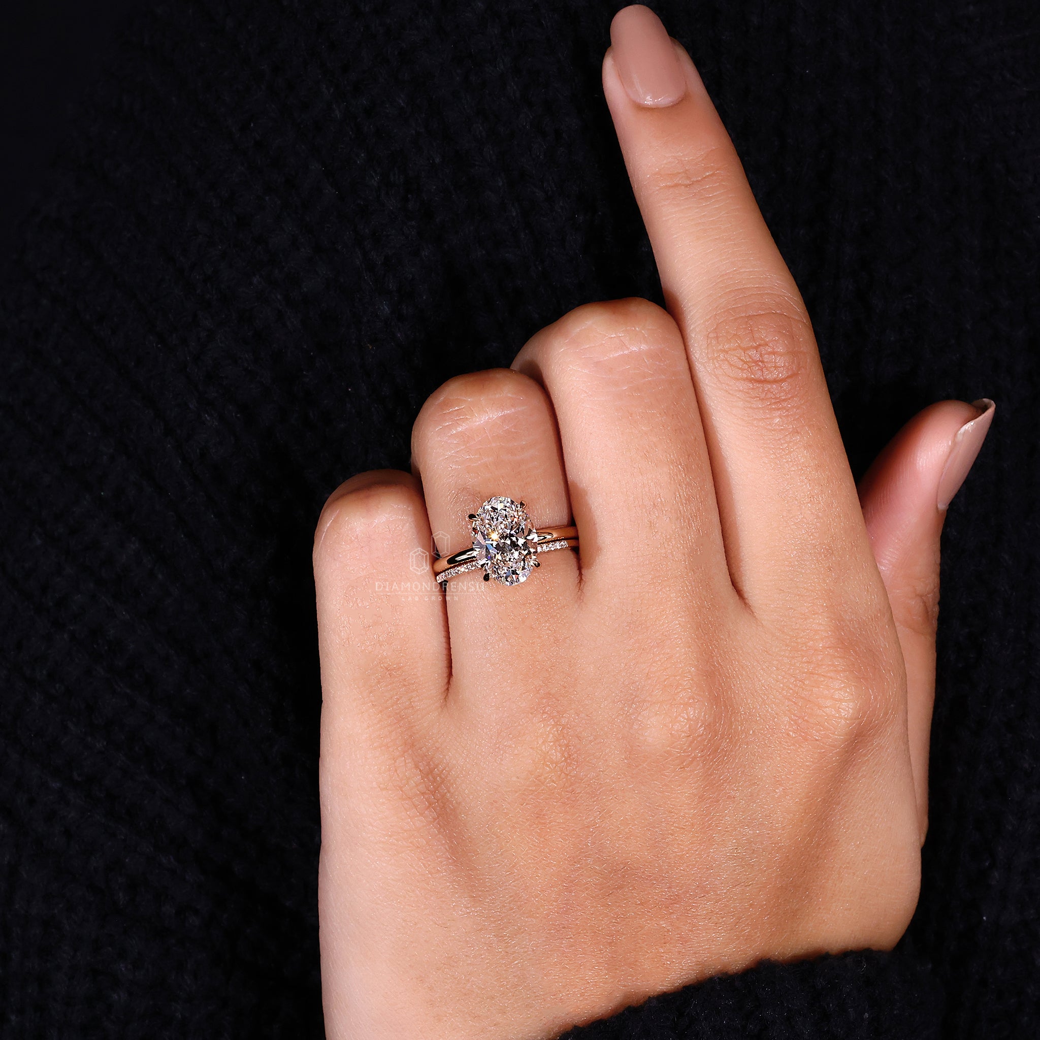 Minimalist diamond band in yellow gold bridal set with solitaire engagement ring.