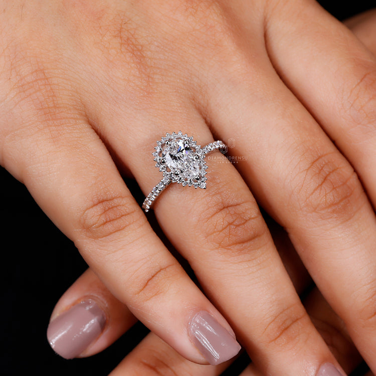 Handmade jewellery featuring a pear cut diamond in a custom band.