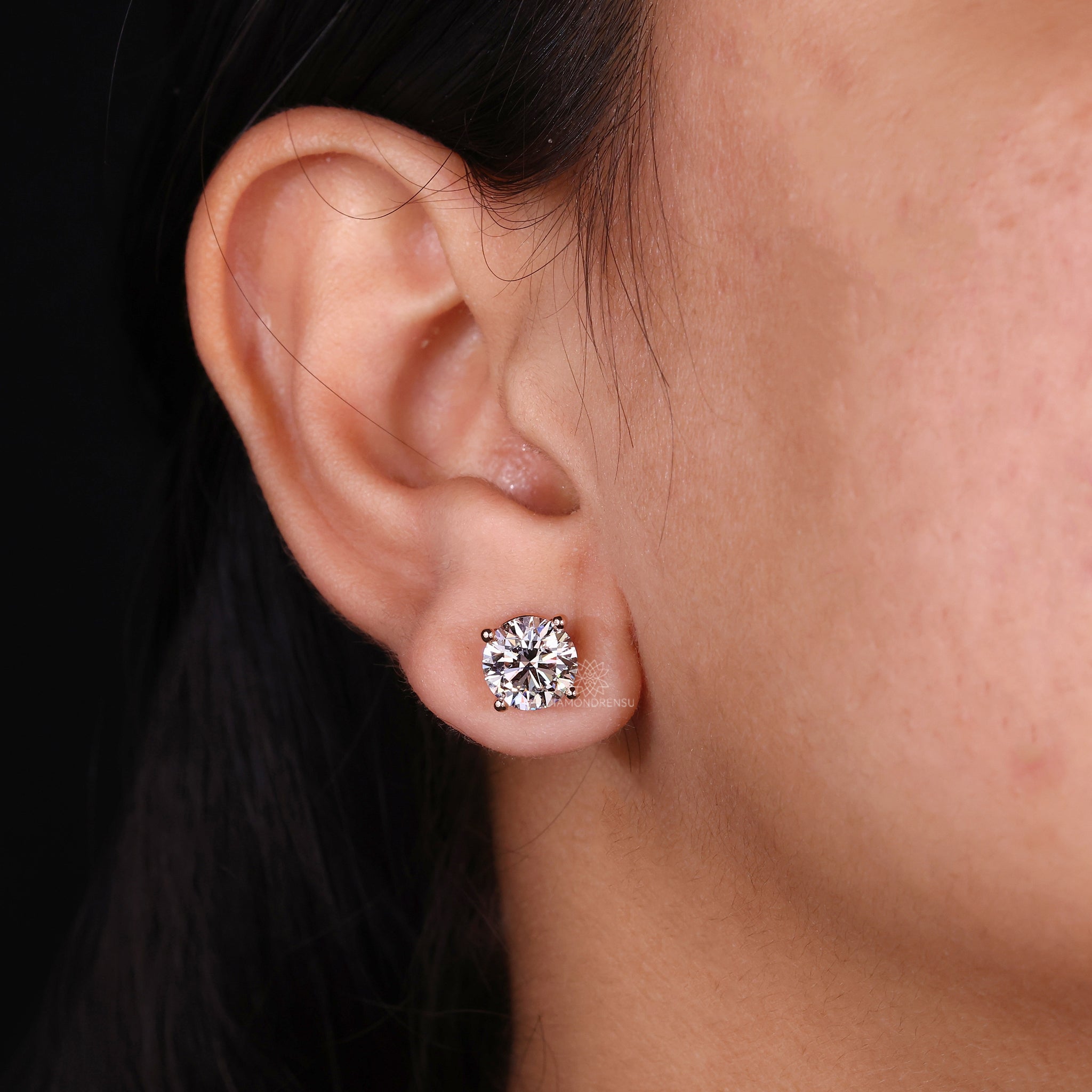 Round cut diamond earrings with screw back.